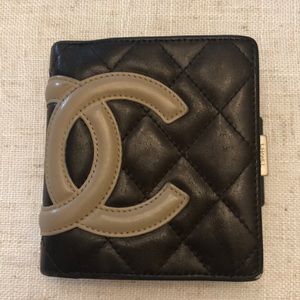 Beautiful Chanel wallet with orange interior.